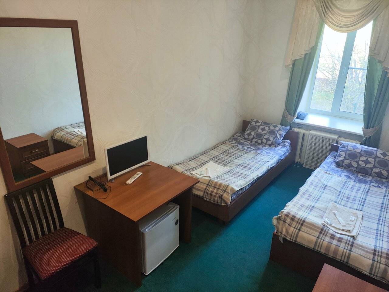 Фотографии номера Улучшенный двухместный номер с 2 отдельными кроватями в Гостинице Третьяков Кострома